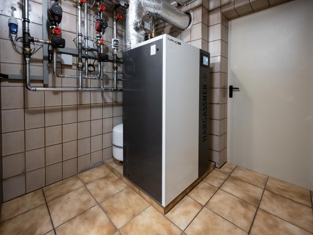 Nano-PK 15 in the boiler room with pipework and control technology, reference single-family house Damberger