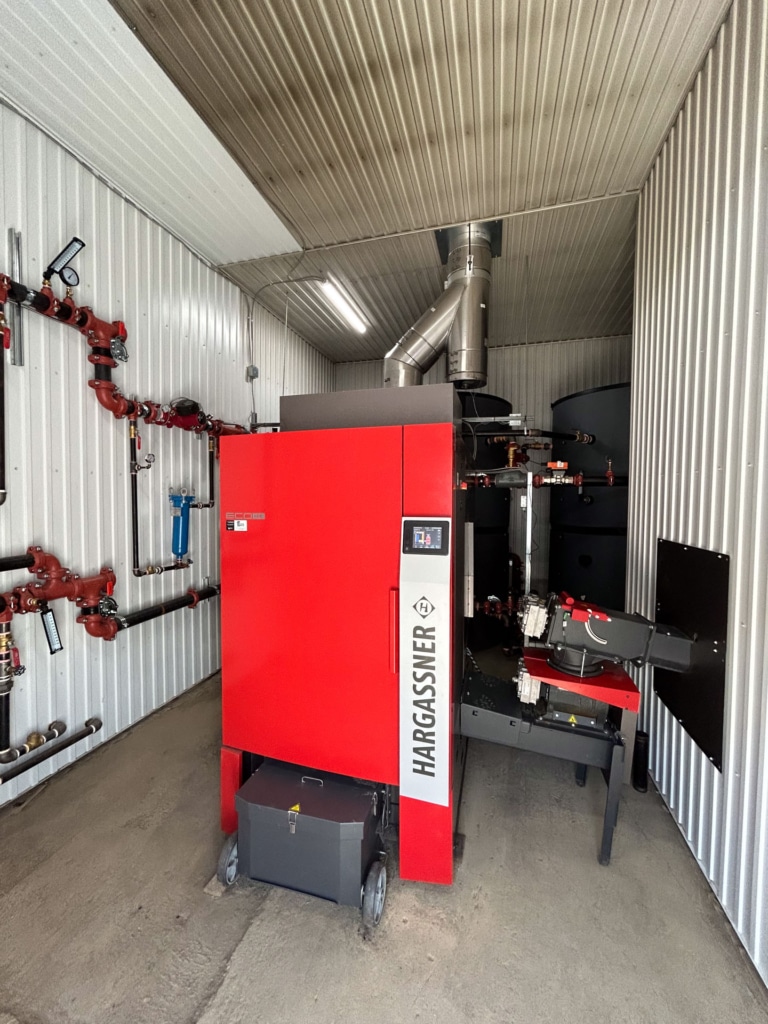 Wood chip boiler Eco-HK 330 in boiler room, Érablière Escuminac, Quebec